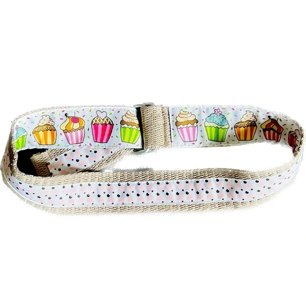 Belt, cupcakes and reverses to hearts on backside Celebrate in style.Adjustable